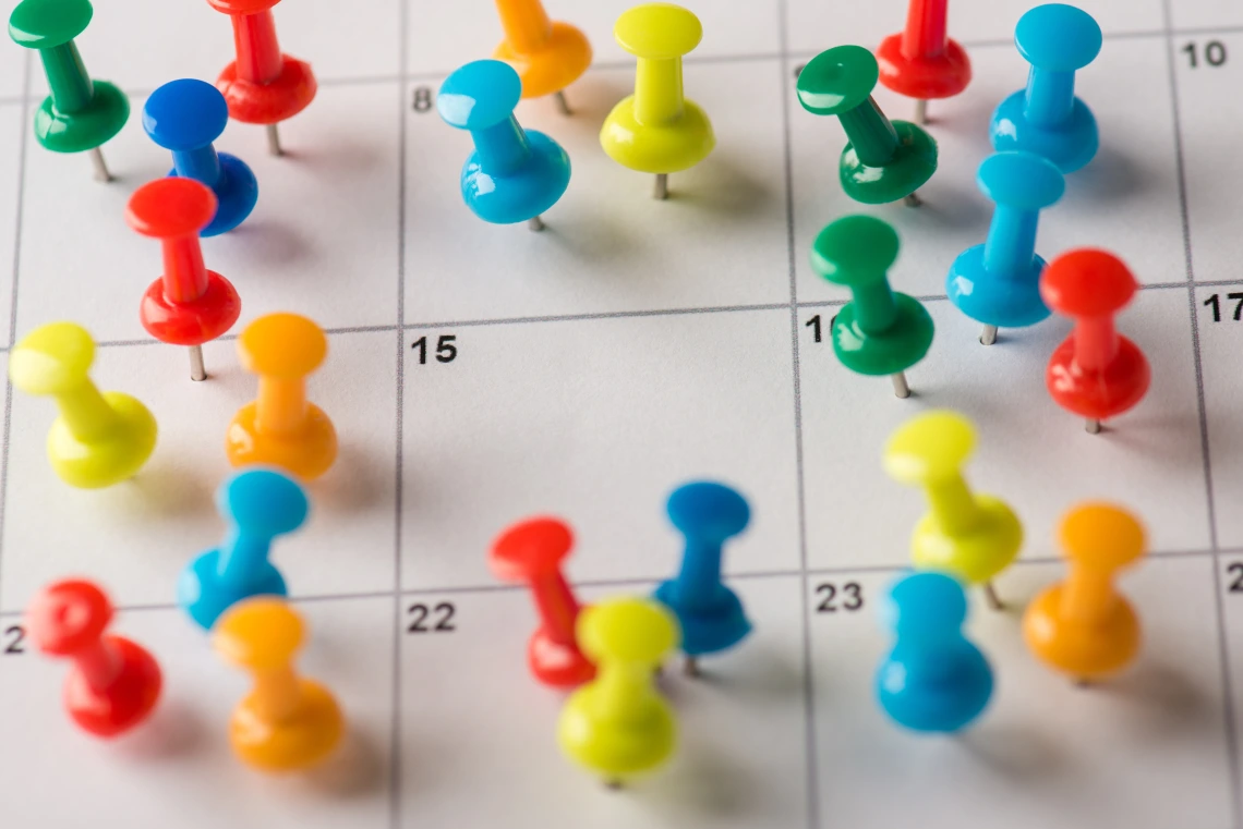 Calendar with Push Pins Meeting Reminder